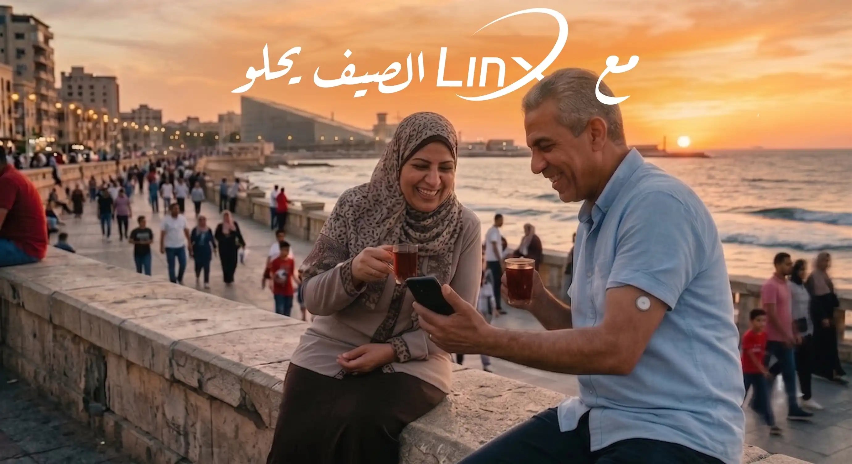 A happy couple enjoys sunset tea by the sea, tracking glucose with the linx cgm sensor best price in egypt.