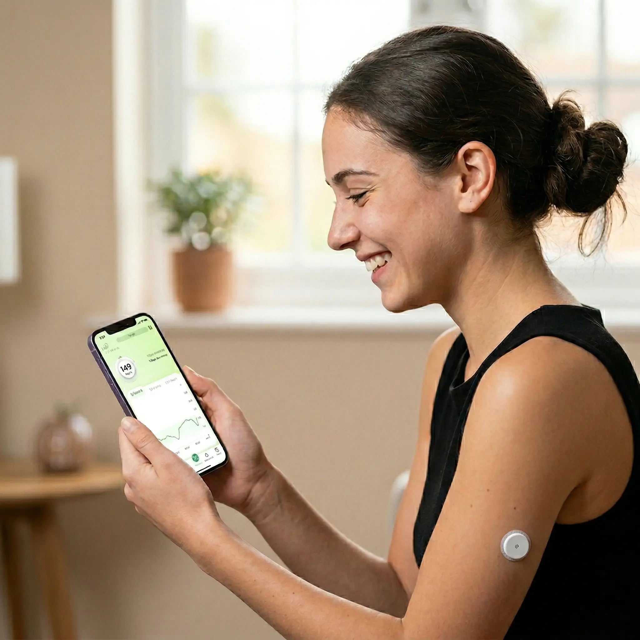 A happy young woman wearing a SENSOR LYNX on her arm checks her glucose reading on her smartphone.