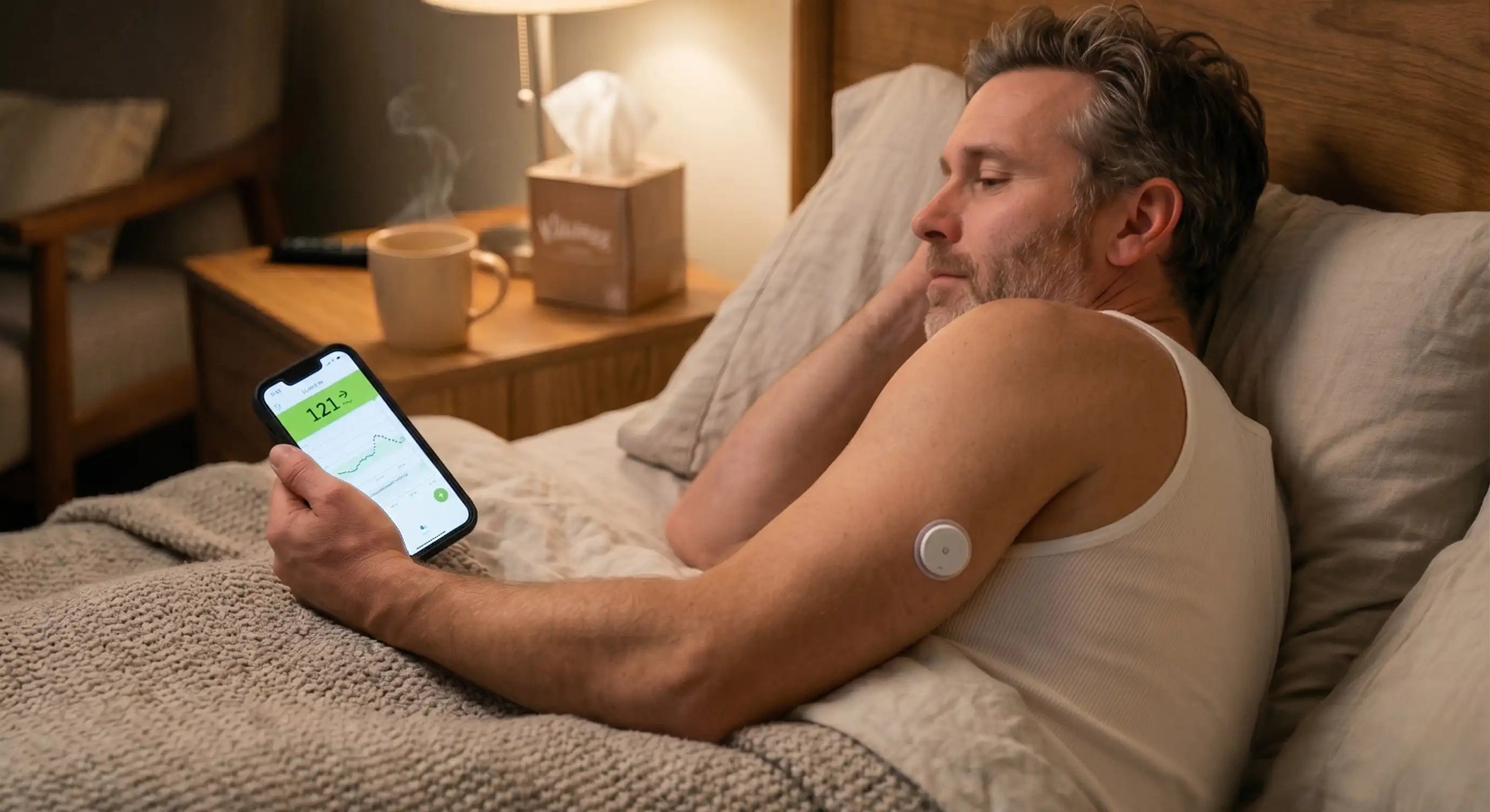 A man with diabetes manages sick-days, monitoring his glucose levels with a Linx CGM sensor and mobile app