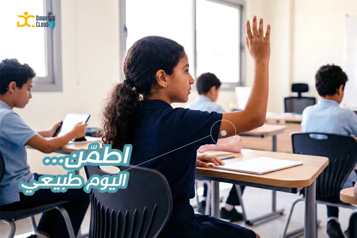 Young schoolgirl with arm glucose monitor raising hand in class