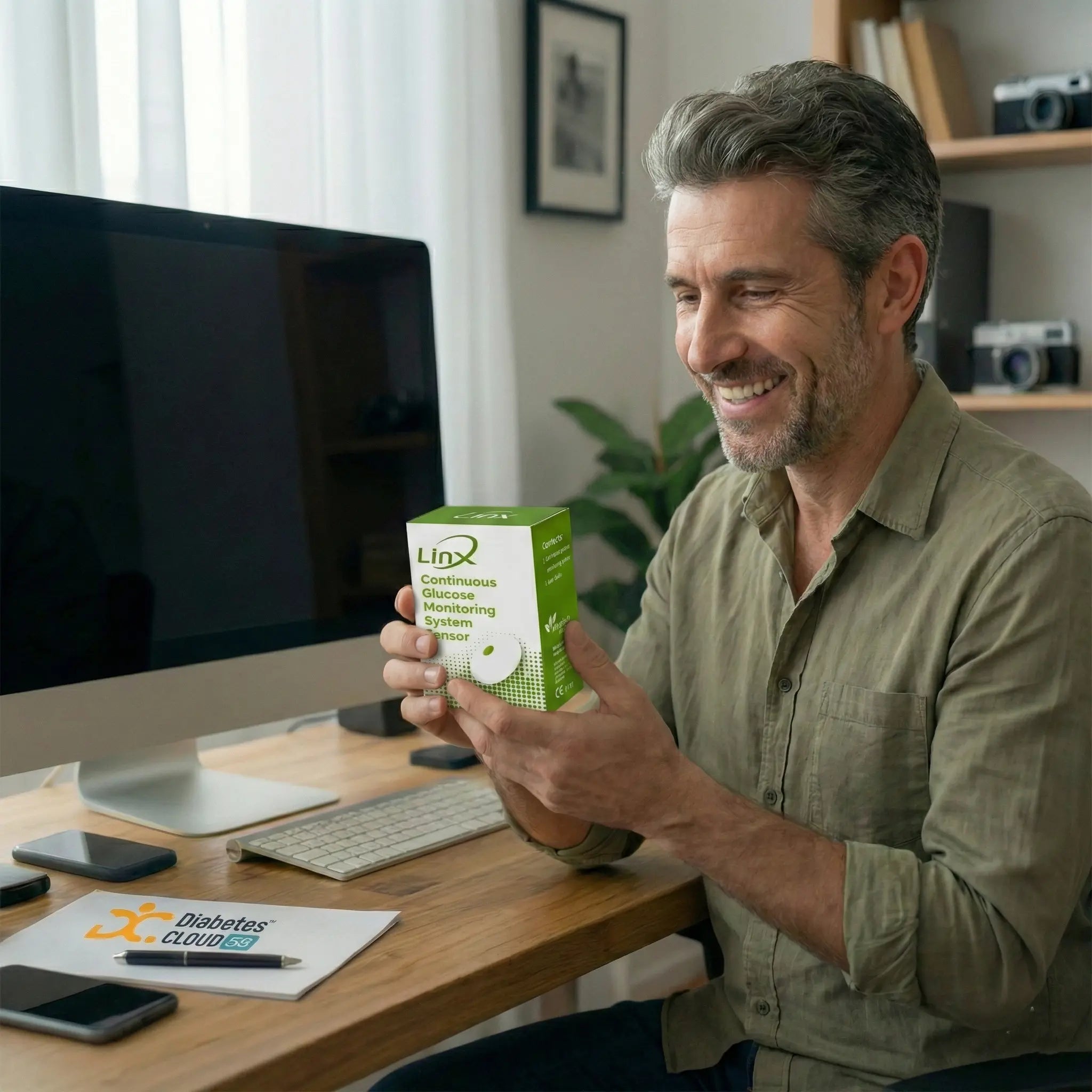 Happy user holds the new LinX glucose sensor packaging box